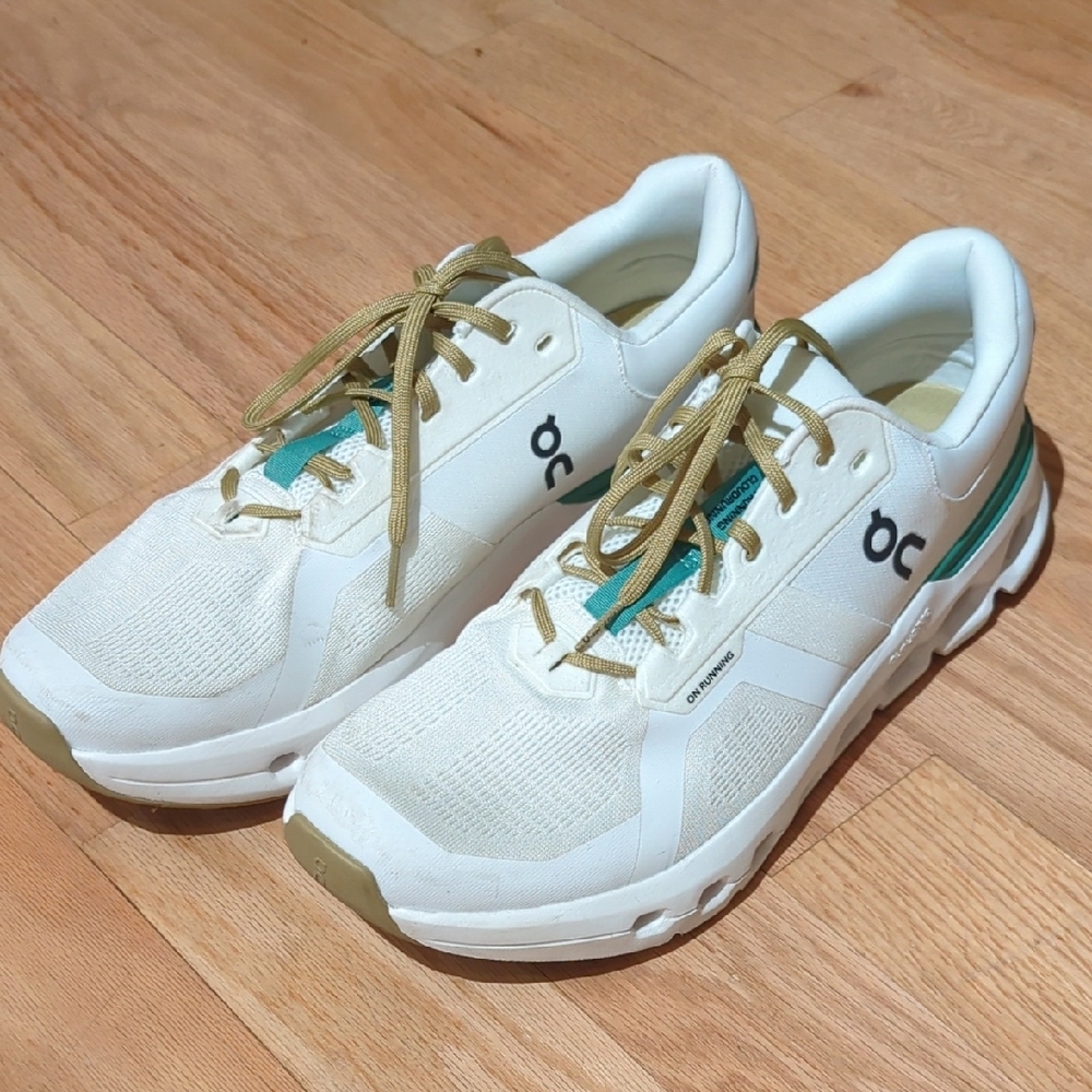 On Running White Sneakers with Green Accents